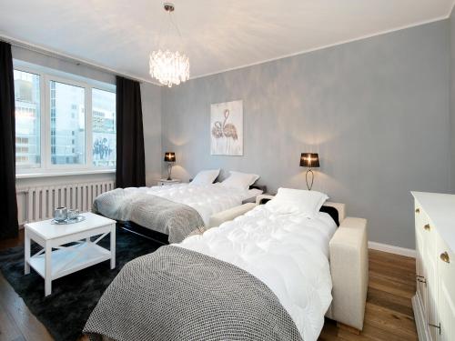 En eller flere senge i et værelse på Gonsiori 7 Lux Apartment