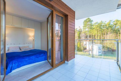 מיטה או מיטות בחדר ב-Apartamenty NCNK Baltic Park PREMIUM w Stegnie - 500 m do plaży