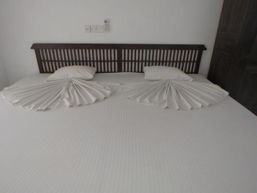 Ein Bett oder Betten in einem Zimmer der Unterkunft Paradise Bay