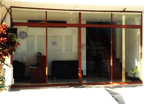 a large glass window of a building with a room at Casa D´Cristhi in Puerto Baquerizo Moreno