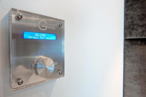 a metal box with a sign that reads logic fires for room at G Design Hotel in Ljubljana