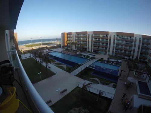 a view of a swimming pool from a building at Sun Residence in Fortaleza