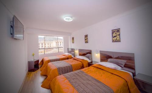 Postel nebo postele na pokoji v ubytování Hotel Peru Real