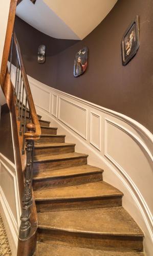 a staircase in a home with a stair case at Gite "le millésime" in Épernay