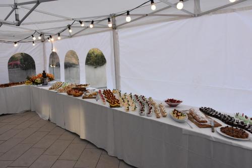 a long table with many different types of food on it at Hotel Gstatsch in Alpe di Siusi
