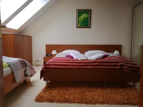a bedroom with a bed and a skylight at Luxury Apartment in Bešeňová