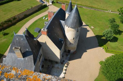 an aerial view of a building with a castle turret at Château de Mazières in Tendu