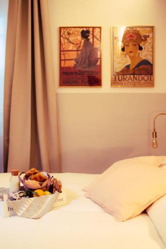 Ένα ή περισσότερα κρεβάτια σε δωμάτιο στο Arsenale Suites