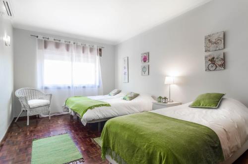 Кровать или кровати в номере Apartamento Costa Pinto