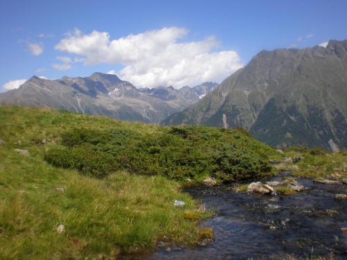 a view of a mountain range with a river at Gästeheim Anna in Längenfeld