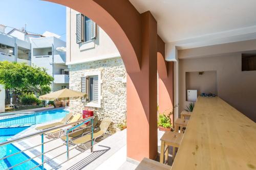 an external view of a villa with a swimming pool at Philoxenia Villas in Panormos Rethymno
