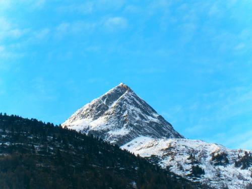 a snow covered mountain on top of a hill at Gästeheim Anna in Längenfeld