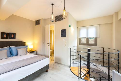 a bedroom with a bed and two lights at Philoxenia Villas in Panormos Rethymno