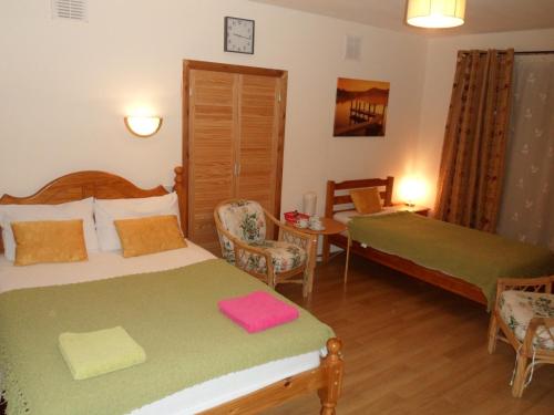 Posteľ alebo postele v izbe v ubytovaní Stansted Airport Lodge