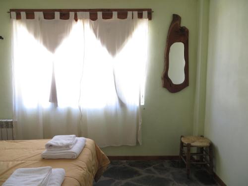 Voodi või voodid majutusasutuse Hosteria del Sauquen toas