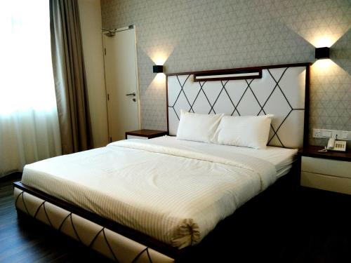 Wifi Boutique Hotelにあるベッド