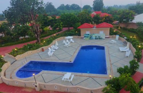 an overhead view of a swimming pool on a patio at Sterling Kanha in Kānha