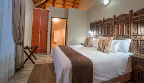 La Kruger Lifestyle Lodge - No Loadsheddingにあるベッド