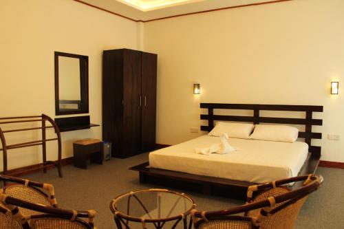 Lova arba lovos apgyvendinimo įstaigoje Nico Lagoon Hotel