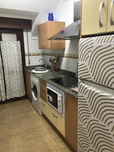 Una cocina o zona de cocina en Apartamentos Costa Noja