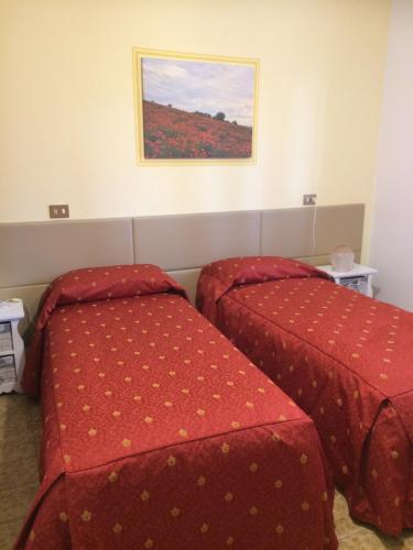 Postel nebo postele na pokoji v ubytování Albergo Filietto