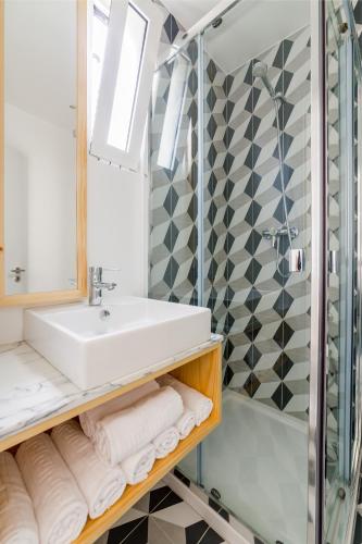 a bathroom with a sink and a shower at Lisbon heart 1-cozy Flat-Family Friendly in Lisbon