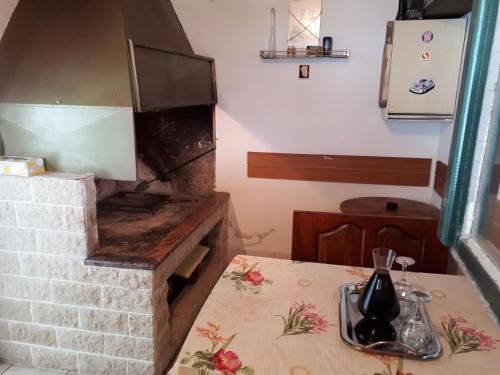 a kitchen with a brick oven with a table at Seaside apartment for 2 p in Trogir