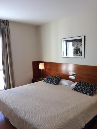Un ou plusieurs lits dans un hébergement de l'établissement Hotel Alda Ciudad de Soria