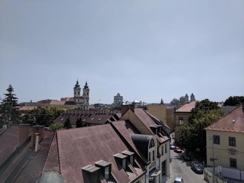 an overhead view of a city with roofs at Minaret Apartman in Eger