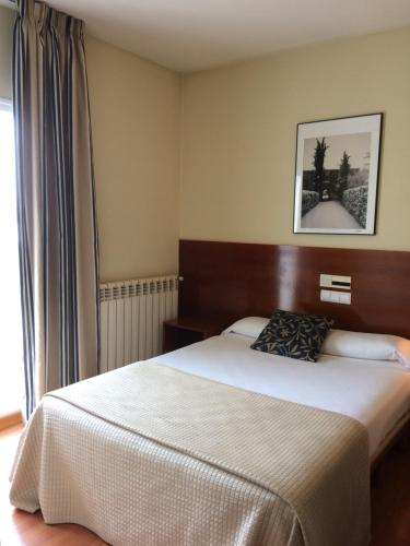 Un ou plusieurs lits dans un hébergement de l'établissement Hotel Alda Ciudad de Soria