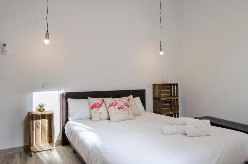 Een bed of bedden in een kamer bij Luminoso familiar- 2D 2B- Cava Alta