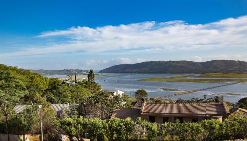 a view of a river and a house at Moncrieff Manor in Knysna