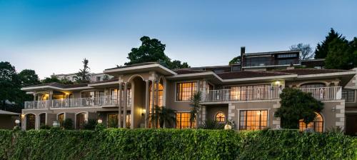 a large house with a lot of windows at Moncrieff Manor in Knysna