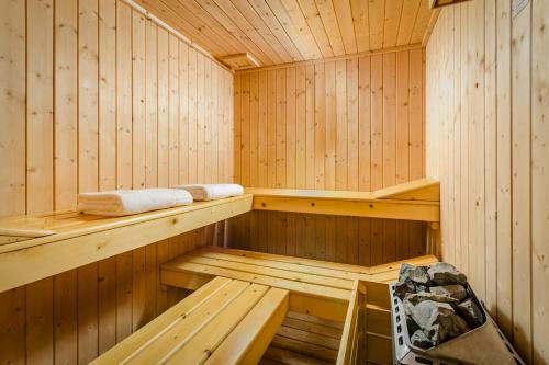 a wooden sauna with benches and towels in it at Eurostars Centrale Palace Hotel in Palermo