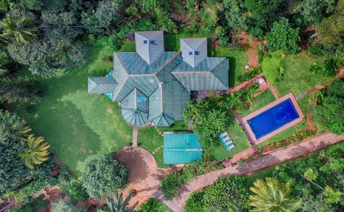an aerial view of a house with a swimming pool at Sweet Cinnamon Kandy in Kandy