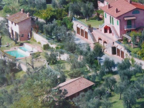 an aerial view of a house with a swimming pool at Villa il Pino by VacaVilla in Lari