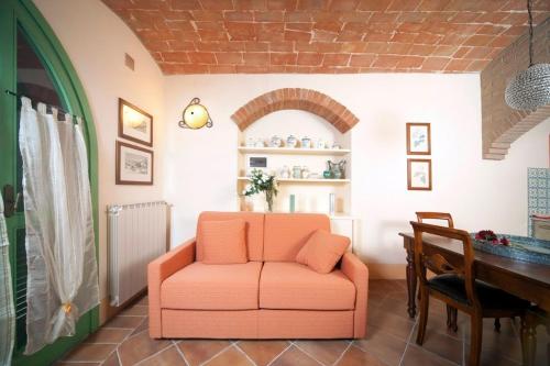 A seating area at Villa il Pino by VacaVilla