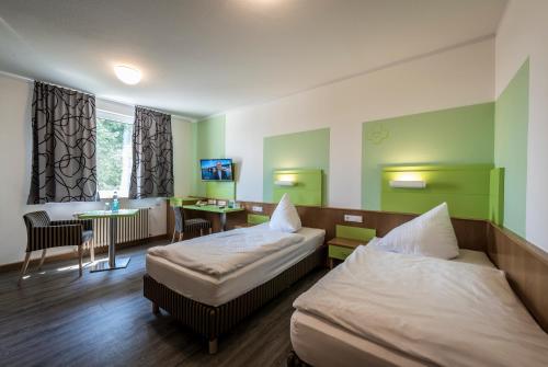 Ένα ή περισσότερα κρεβάτια σε δωμάτιο στο Kloster Neustadt