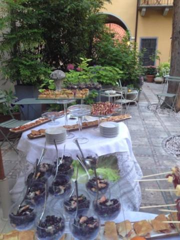 a table with a buffet of food on it at Albergo Residence Perosi in Tortona