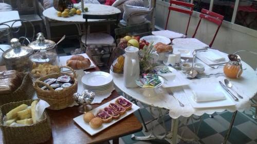 a table with plates of food on top at Albergo Residence Perosi in Tortona
