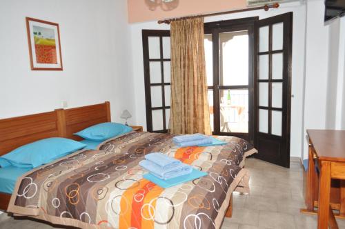 Posteľ alebo postele v izbe v ubytovaní Giannis Maria Apartments