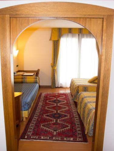 Una cama o camas en una habitación de Hotel Piroga Padova