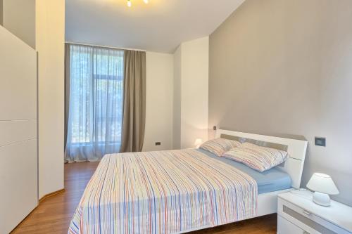Postel nebo postele na pokoji v ubytování Apartments Villa YoYo