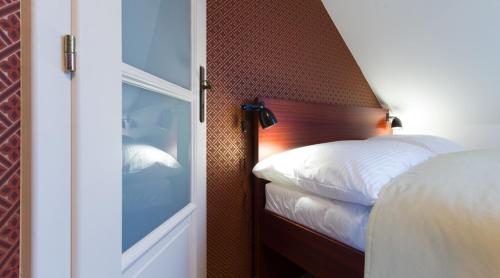 Cama ou camas em um quarto em Residence Arx & Wellness