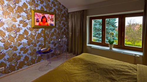 Cama ou camas em um quarto em Residence Arx & Wellness