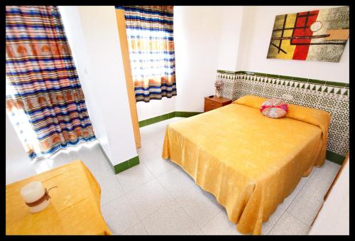 Ένα ή περισσότερα κρεβάτια σε δωμάτιο στο Hostal Estación