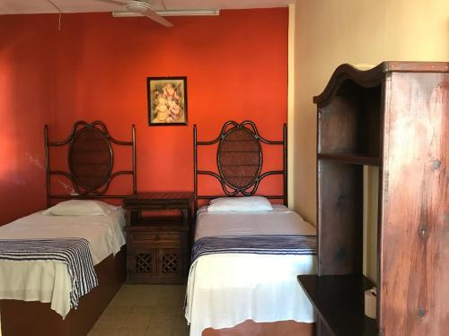 Postel nebo postele na pokoji v ubytování Hotel Estrella del Mar