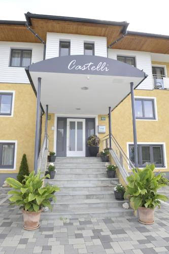 a staircase leading to a building with a sign on it at Villa Castelli in Schladming