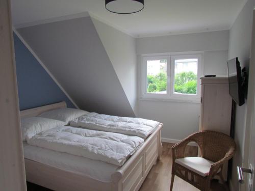 Ein Bett oder Betten in einem Zimmer der Unterkunft Dorie