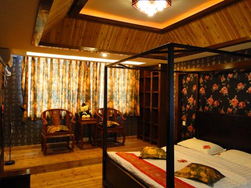Letto o letti in una camera di Mount Emei Teddy Bear Hotel玩具熊酒店